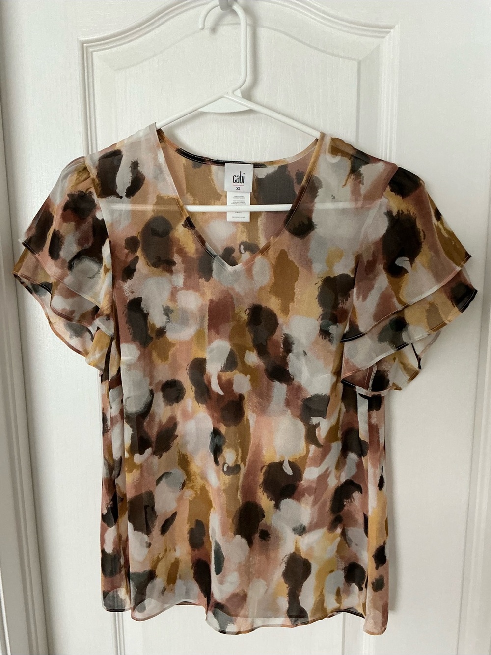 CAbi Watercolor Flutter Sleeve Blouse in Brown, Tan, Cream, Black